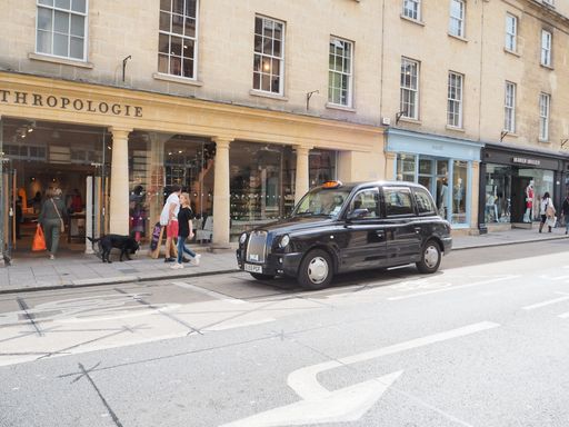A beautiful shot of a black taxi during the day in Bath, UK