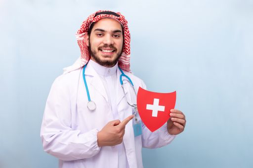 A man doctor holding a red medical solution sign