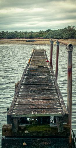 An eerie scenery of the Altona pier on a gloomy day in Melbourne