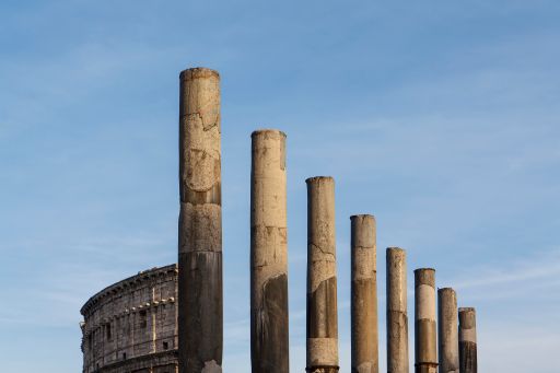 The famous Pillars of the Colosseum in Rome, Italy under a clear sky