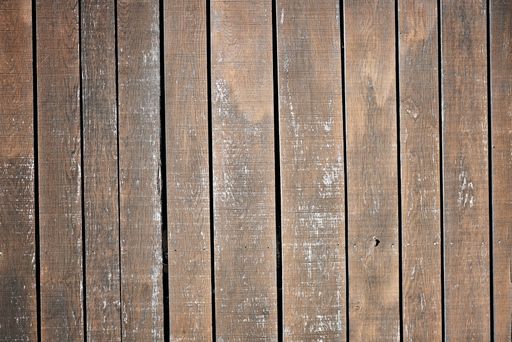 A brown weathered wall made from old wooden boards
