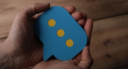 A man's hand holding the sign of message-concept of online communication