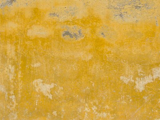 An old dirty yellow textured wall background