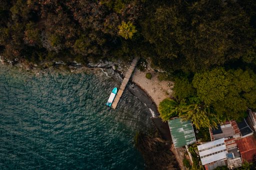 An aerial view of a boat berthed near the coast of Lake Atitlan in Guatemala, Central America