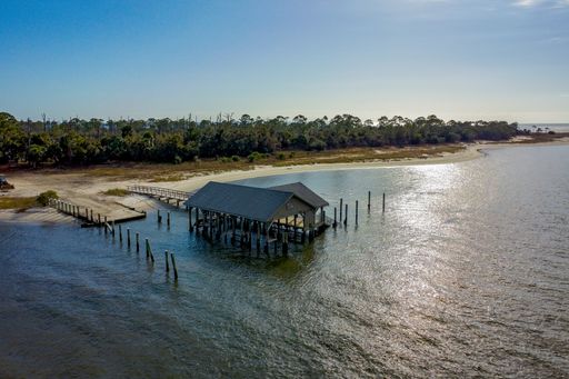 a photo of old abandoned pier in water