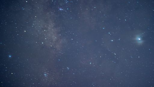 A beautiful view of a blue night sky and stars on dark background Universe filled with stars