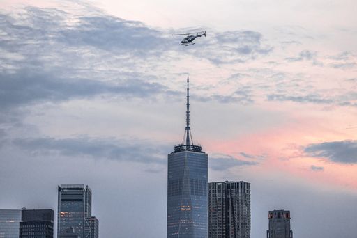 A scenic view of the World Trade Center building in Manhattan, New York City during sunset