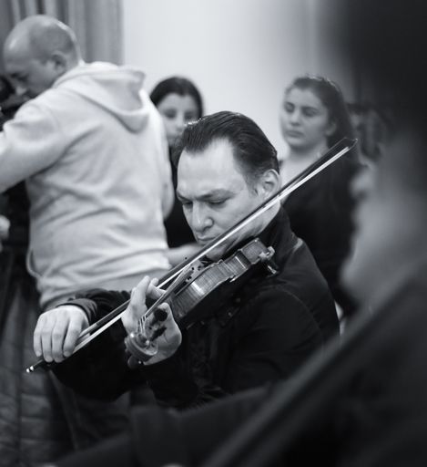 Different musicians performing at Aram Khachatryan concert hall for Tigran Mansuryan's birthday anniversary in Armenia with guests