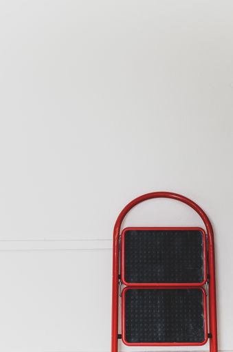 white wall and step ladder with text space