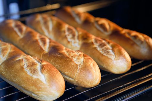 A closeup of crispy browned bread rolls baked in the oven