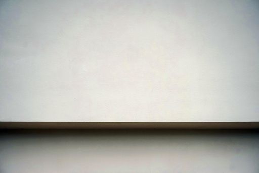 A closeup shot of a beige wall -background