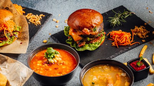 A closeup shot of hamburgers and soups