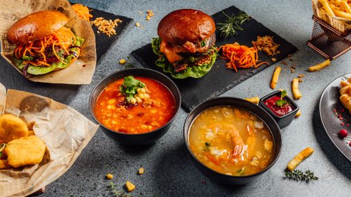 A closeup shot of hamburgers and soups