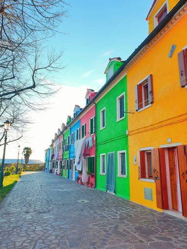 A low-angle shot of colorful painted houses on Burano island, Venice, Italy
