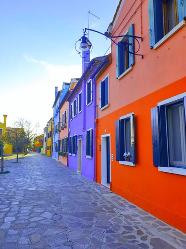 A low-angle shot of colorful painted houses on Burano island, Venice, Italy