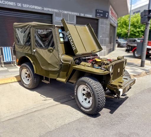 Willys jeep Ford GPW iconic American military off road utility truck. Open hood. Expo Warnes 2021 classic car show.