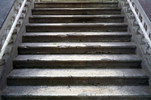 The old weathered broken stairs during daytime