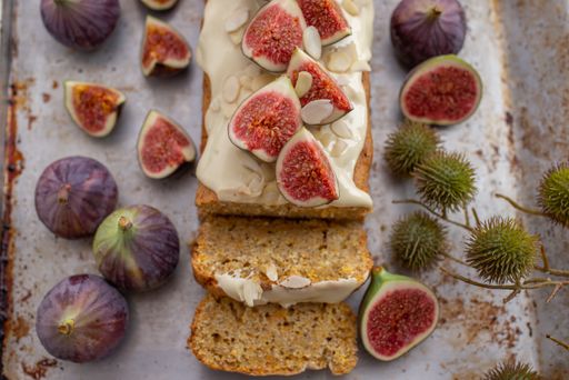 A top view shot of a sweet pumpkin fig cake with frosting decor