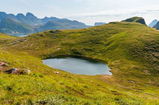 A beautiful scene of a pond in Lofoten Islands in Norway on a sunny day