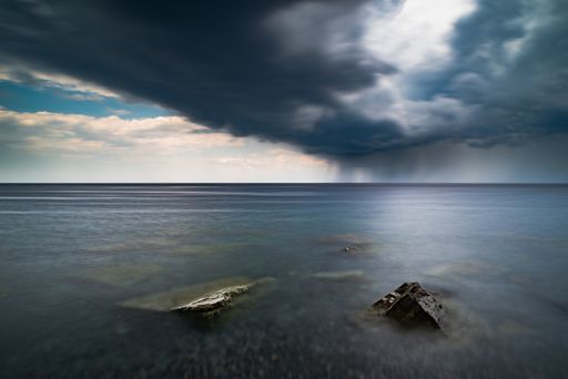 The view of the sea and rocks. Long exposure landscape.