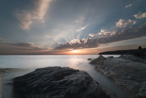 The beautiful seascape at sunset with rock formations in the water