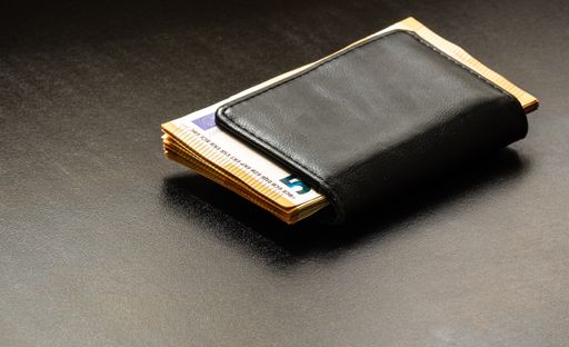 A man wallet with money on the table, wallet with EURO banknotes