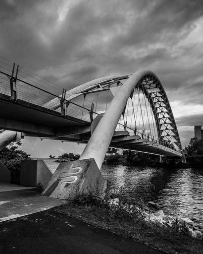 A vertical grayscale shot of Humber Bay Arch Bridge. Toronto, Canada.