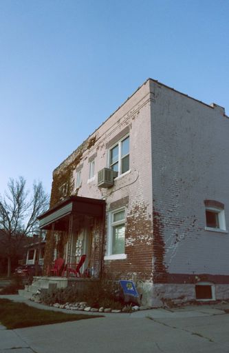 A low angle vertical shot of an old building under the clear sky