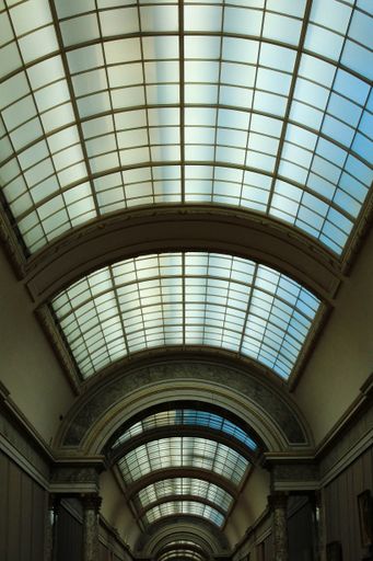 A vertical shot of the glass roof of the Louvre, Paris, France