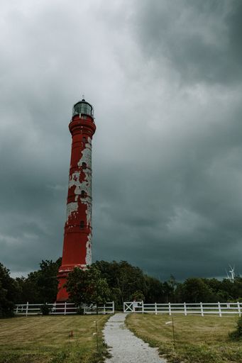 A vertical shot of the Pakri lighthouse in Paldiski, Estonia on a cloudy day