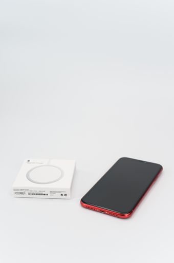 MagSafe wireless induction device charger with cable on a white background with text space