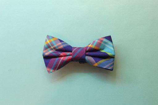 A colorful bowtie on a blue surface