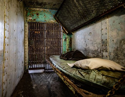 A photo of a rustic metal room in the prison