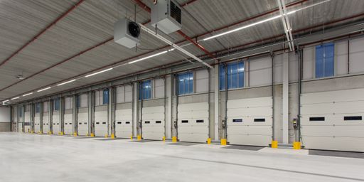 The interior of a new empty warehouse with loading docks ready to be used
