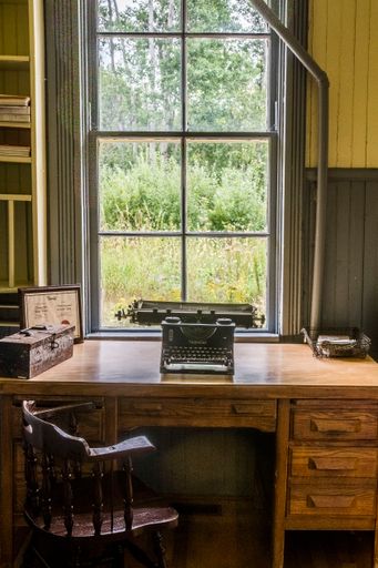 A vertical shot of an old type machine on a table