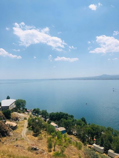 A vertical shot of Lake Sevan shoreline on a clear day, Armenia