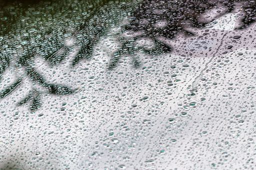A beautiful shot of water drops on the window on a rainy day