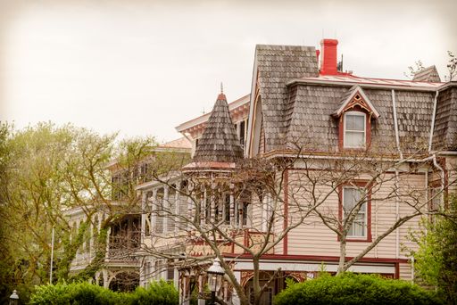 A beautiful house with brick roof tiles under a gloomy sky