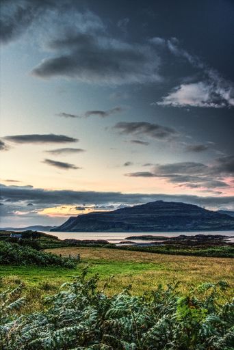 A vertical shot of Scotland beautiful island under the cloudy sky