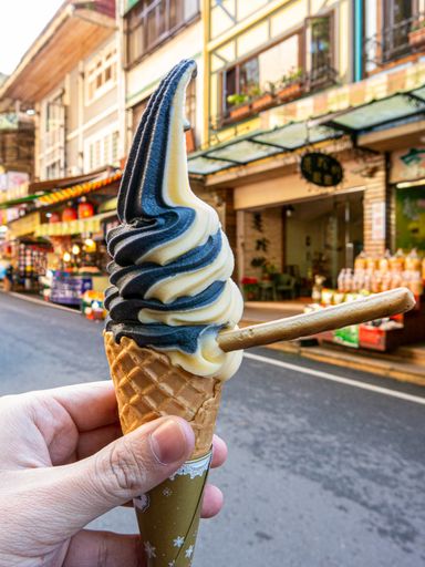 A close-up shot of a male hand holding an ice cream in Taiwan