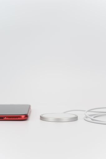 magsafe wireless induction device charger with cable on a white background with text space