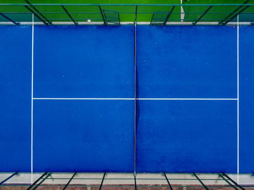 Overhead view of a paddle tennis court from a drone