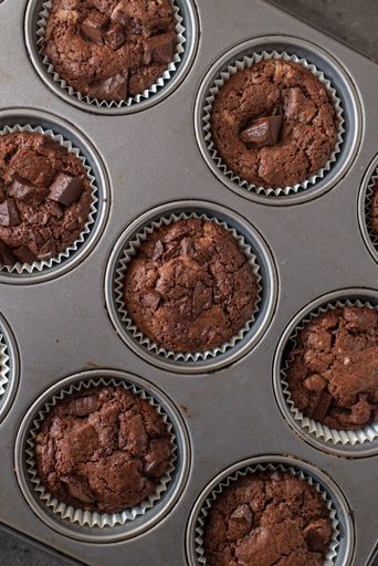 A top view of chocolate chip muffins in a bakeware