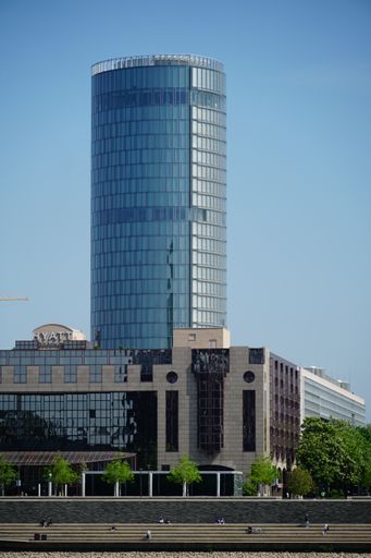 The opposite riverside taken at daylight depicting the high-rising LVR-Tower as well as the Hyatt hotel in front.