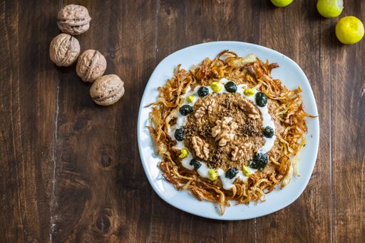 A top view of Persian traditional food on a wooden table