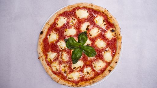 A closeup shot of tasty pizza isolated on a white background