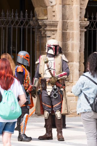 Gijon, Spain: July 03, 2021: Actors representing Star Wars characters, specifically mandalorians, during the celebration of the Comic Con in Gijon