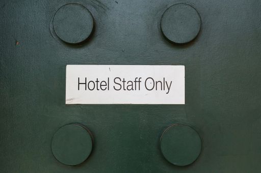 Hotel Staff only text on a green background
