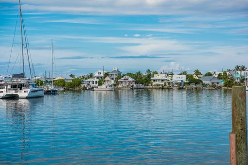 A photo of the blue sky with sailboat in the harbor in Elbow Cay, Abaco, Bahamas