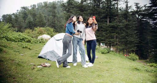 The young Indian girls taking a selfie while hiking